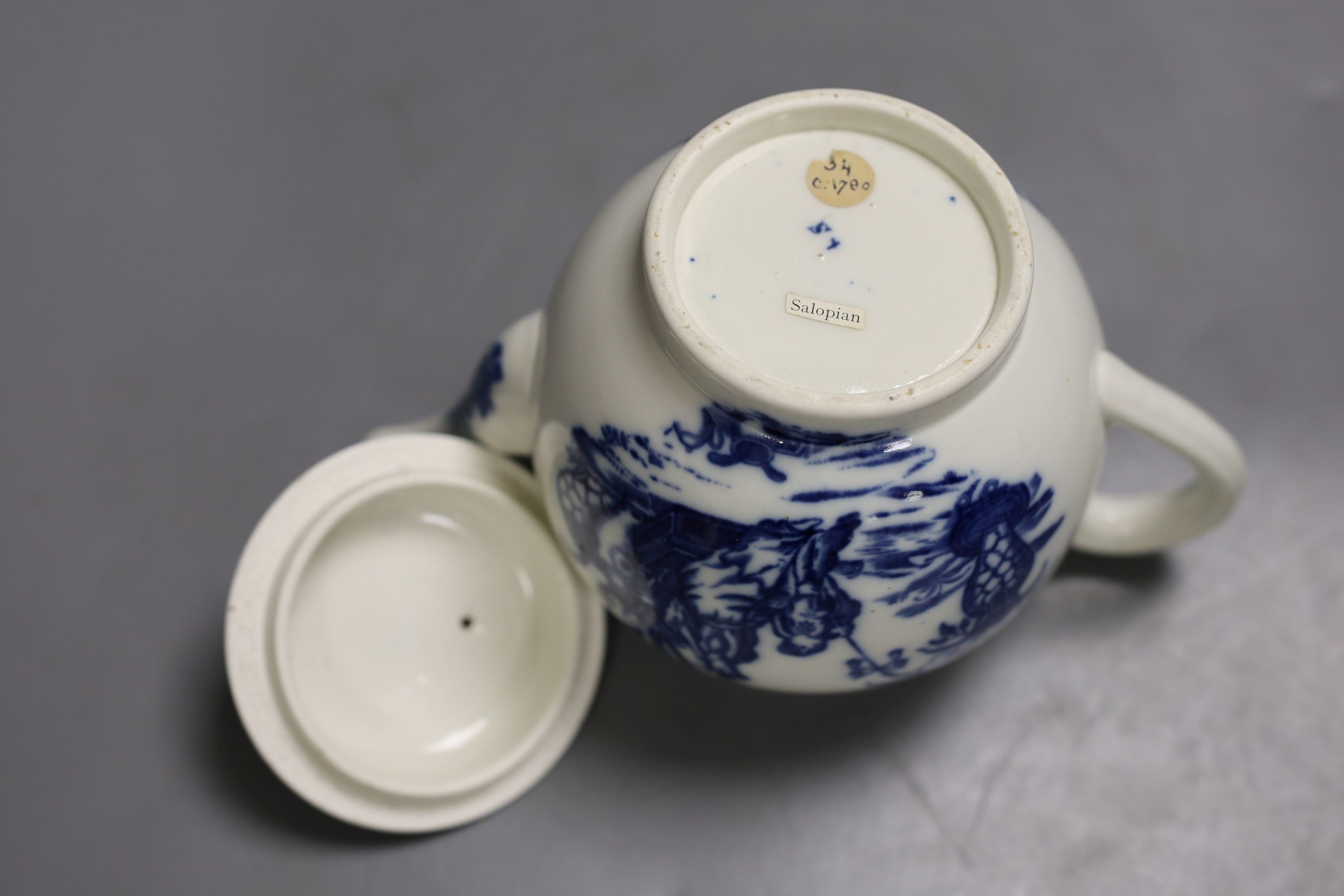 A good Caughley teapot and cover unusually having the same Bell Toy pattern on each side, c.1785, 14.5 cm high